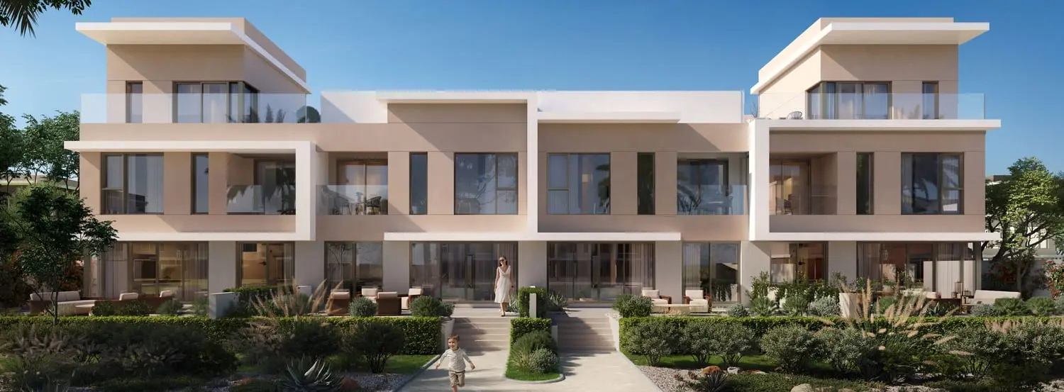 Park-facing townhouse facade and landscaped path at Bayn by Ora, Ghantoot, between Abu Dhabi and Dubai