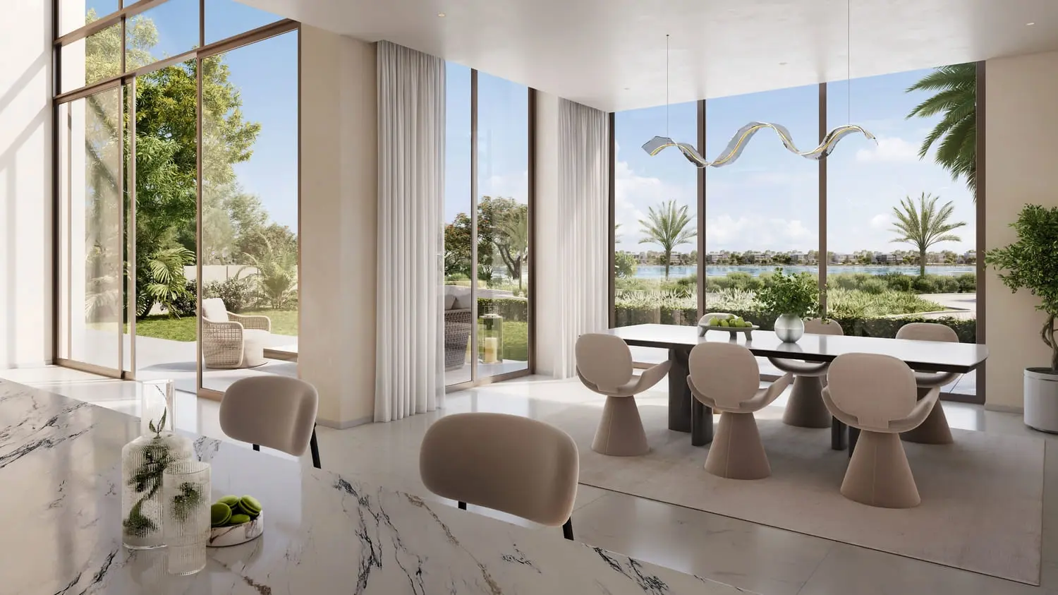 Dining and kitchen interior with lagoon views at Bayn by Ora, Ghantoot, between Abu Dhabi and Dubai