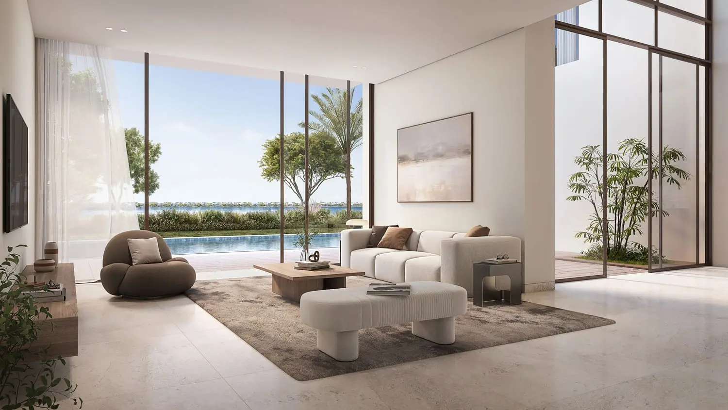Living room opening to pool and lagoon at Bayn by Ora, Ghantoot, between Abu Dhabi and Dubai