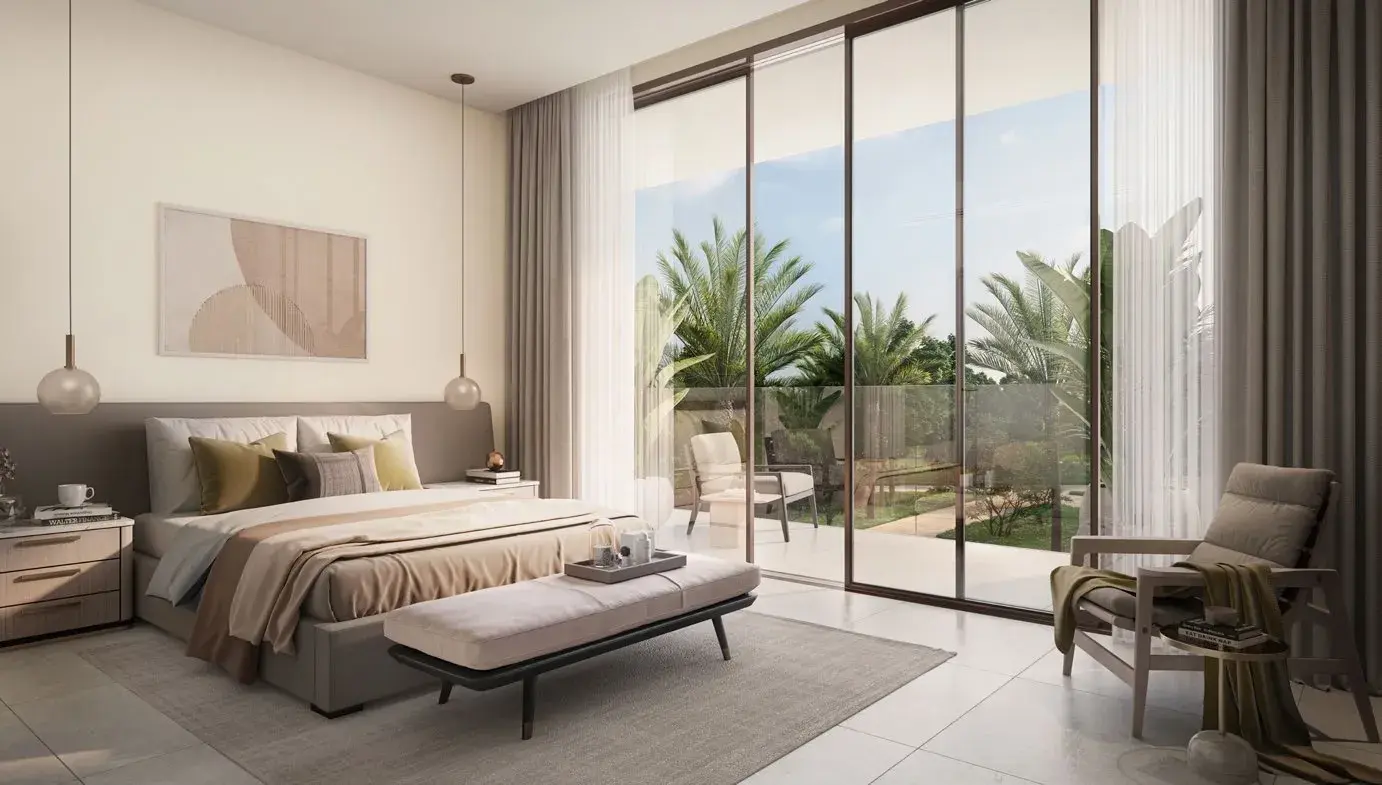 Bedroom with glass doors to a sunlit terrace at Y Views at Bayn, Ghantoot, between Abu Dhabi and Dubai