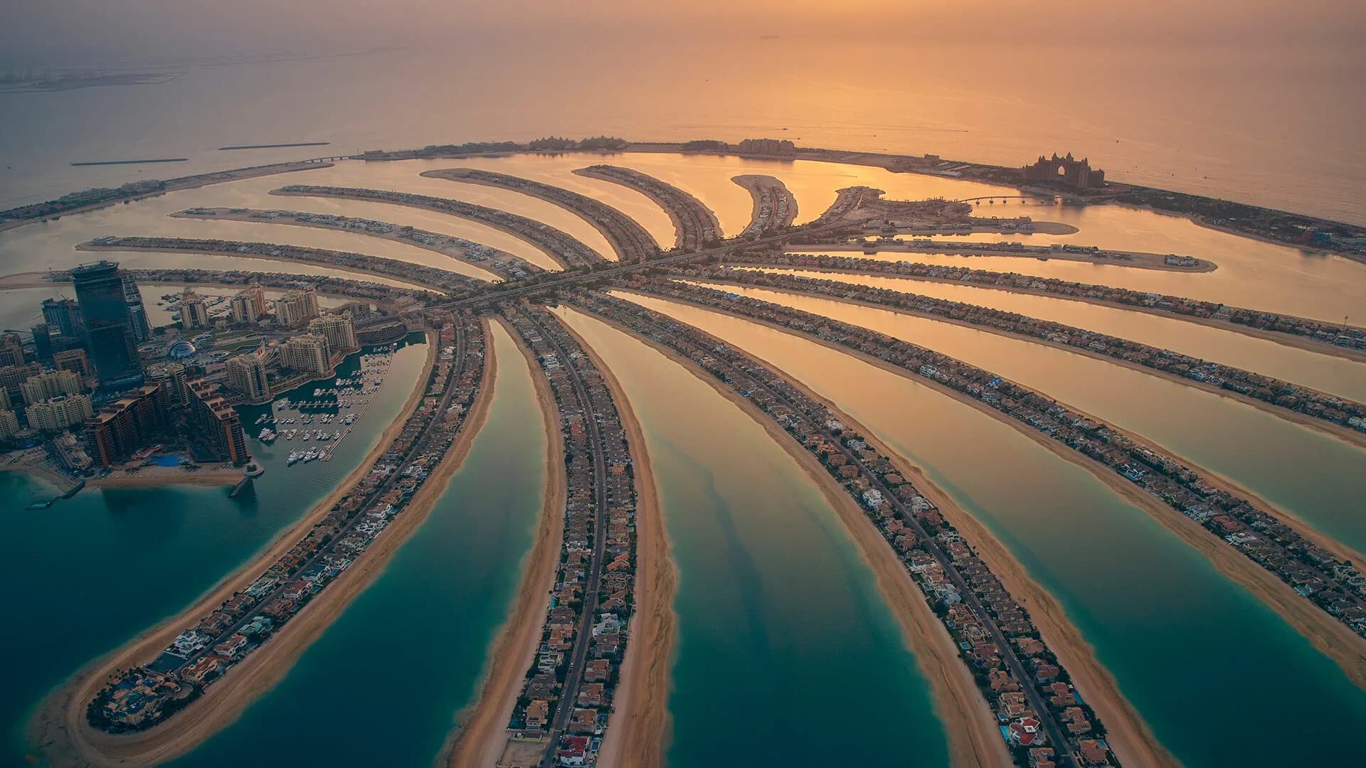 Reference image: Palm Jumeirah aerial at sunset by Nakheel — developer portfolio, not Palm Springs